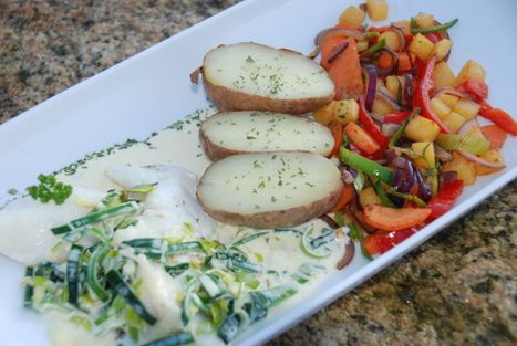 Steamed cod with leek sauce and vegetables